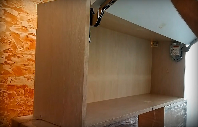 attach two support brackets to the cabinet door