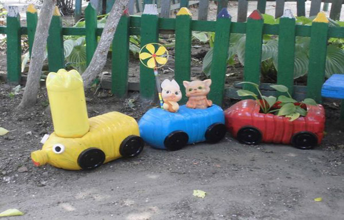 bright train made from large plastic bottles